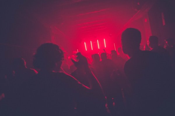 Crowd on the Main Room dance floor under red lights